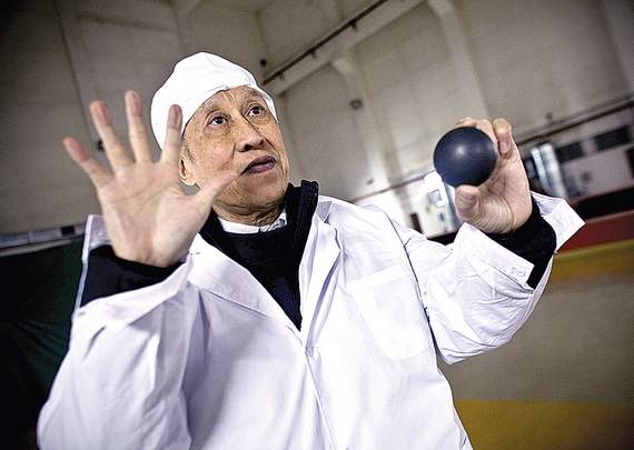 Dr. Xu Yuanhui, the vice general manager of Chinergy, holds a uranium-filled graphite pebble at the Tsinghua University pebble bed nuclear reactor research facility, in Nankou, China. (Source: Shiho Fukada, NYT News Service)