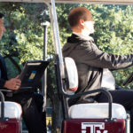 Chen and Marianno in golf cart
