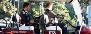 Chen and Marianno in golf cart