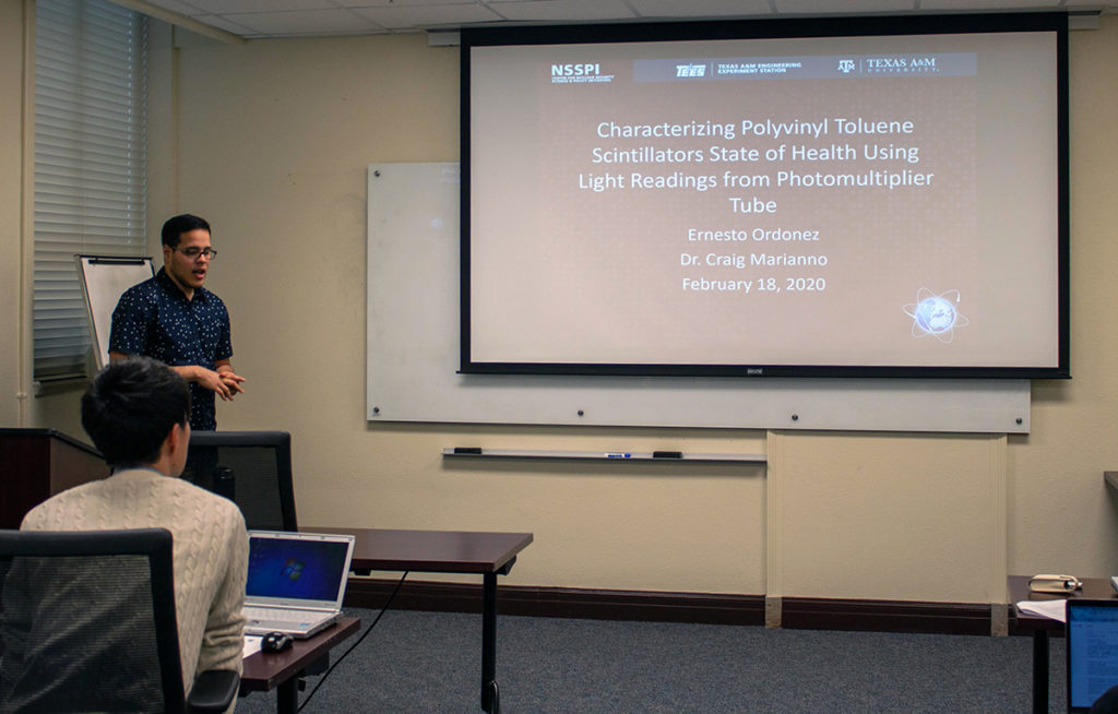 photo of Ordonez giving research presentation to Japanese student visitors