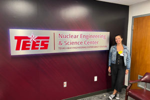 Delfina di Lorenzo of Argentina poses in front of the NESC sign. (Photo credit: Kelley Ragusa)